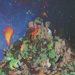 The Light Up Waltz Album cover. The album cover is a mountain of warm colors. orange, red, and green splatches jump around over a speckled blue background.