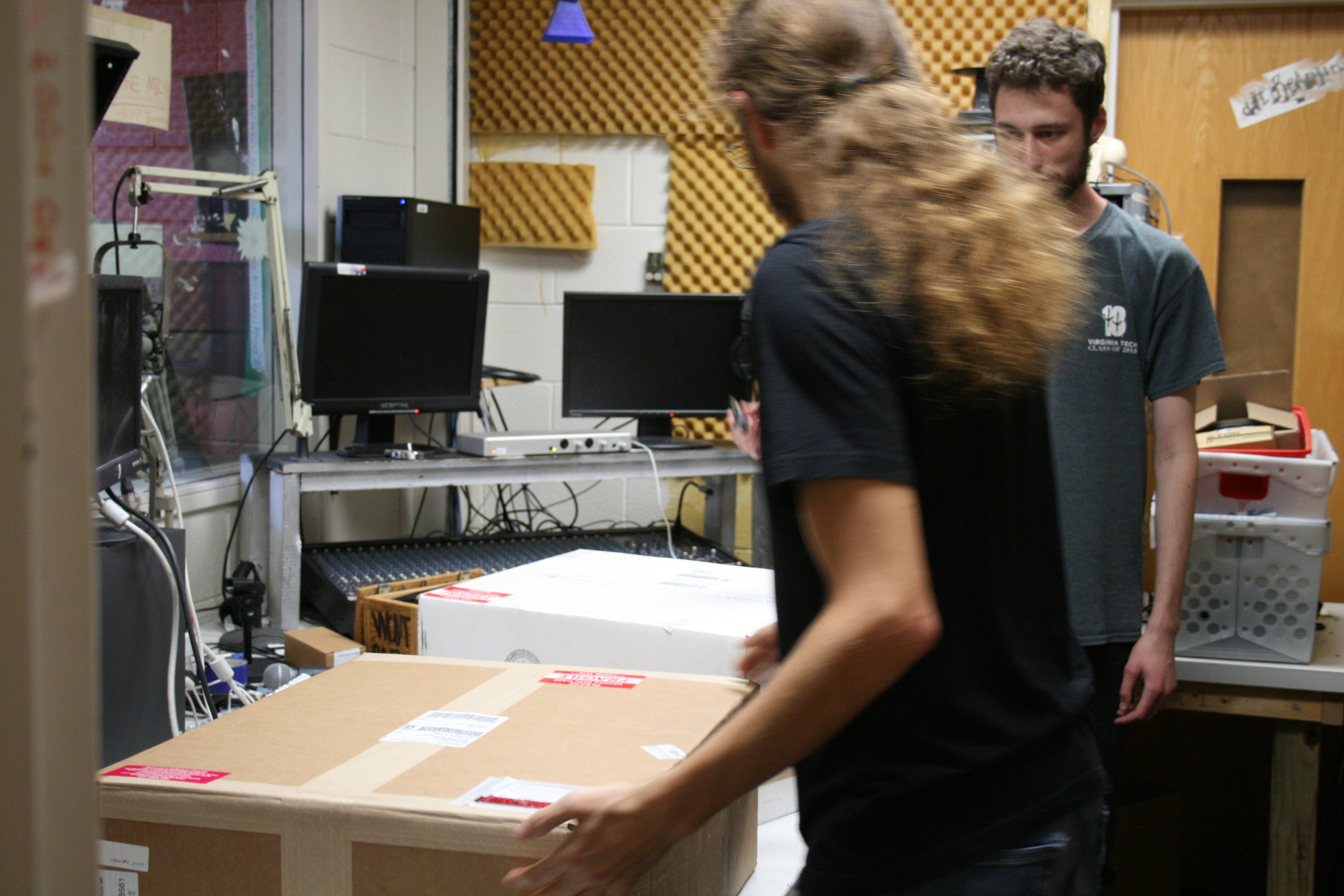 a photo of staff members unpacking the new board