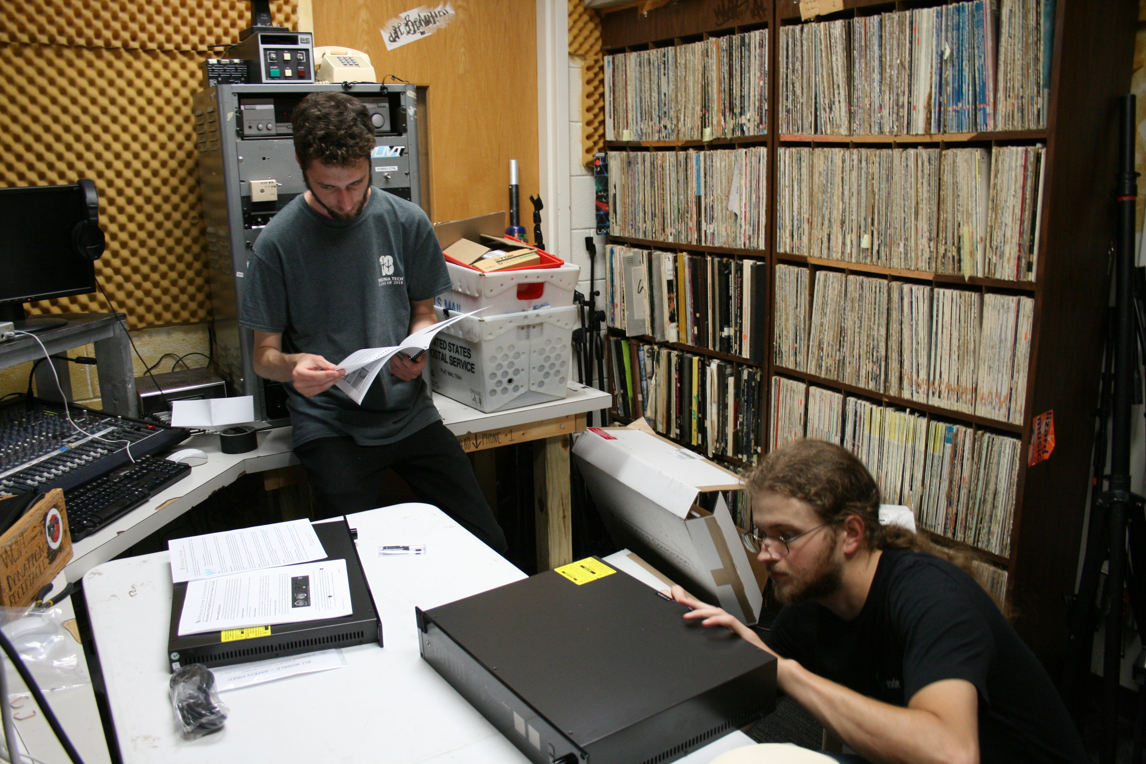 a photo of the staff members looking over the equipment