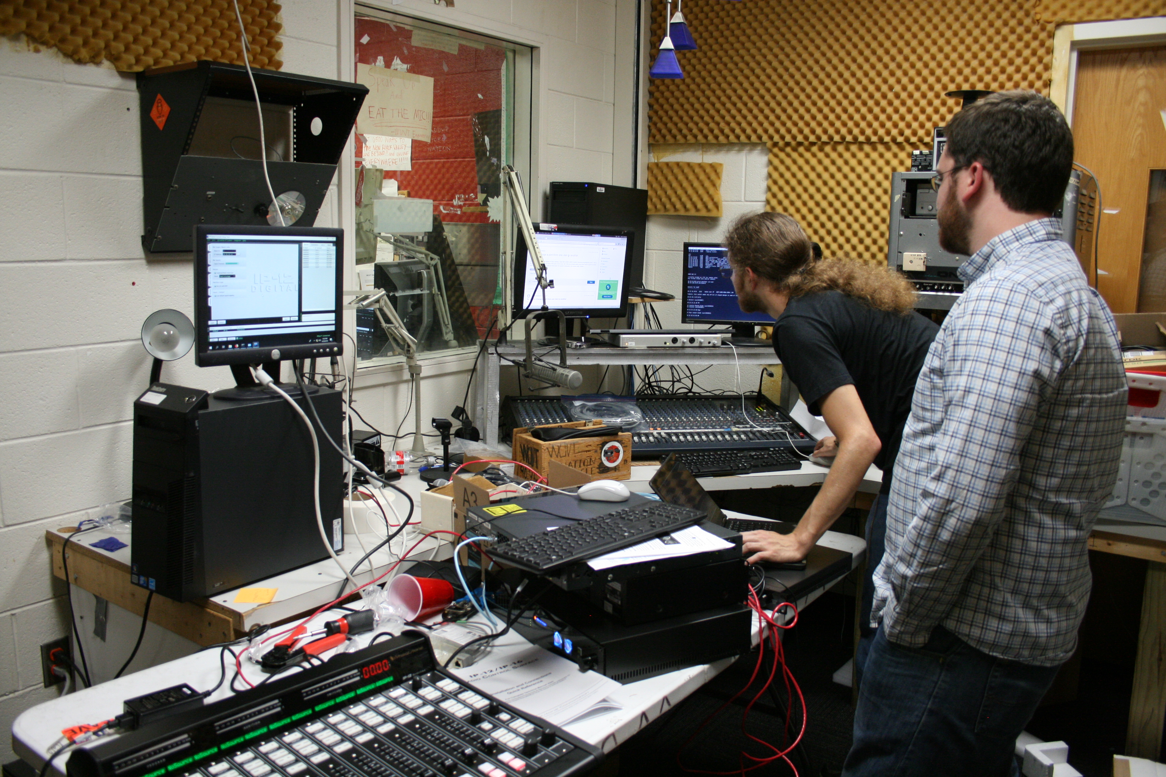 a photo of the staff members setting up the AoIP network