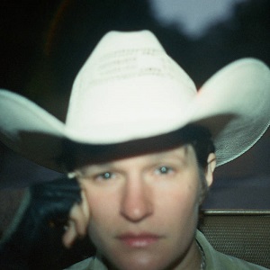 Bright Future album cover. Adrianne Lenker's face centered in the frame wearing a white cowboy hat