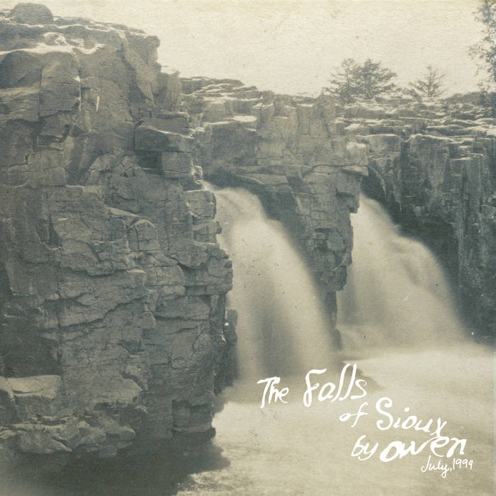 The Falls Of Sioux album cover. A calm grascale photo of a waterfall, with the artist name and album title displayed at the bottom of the stream.